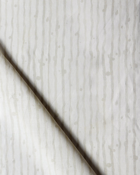 A close up of a white and gray Drippy Stripe Fabric Sand