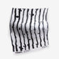 A Drippy Stripe Fabric Slate piece with black and white stripes in Eskayel's signature inky style