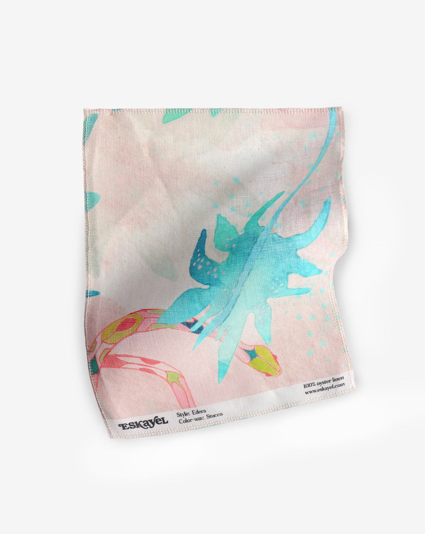 A pink and blue Edera Fabric Stucco with a chinoiserie-inspired pattern on it named Edera