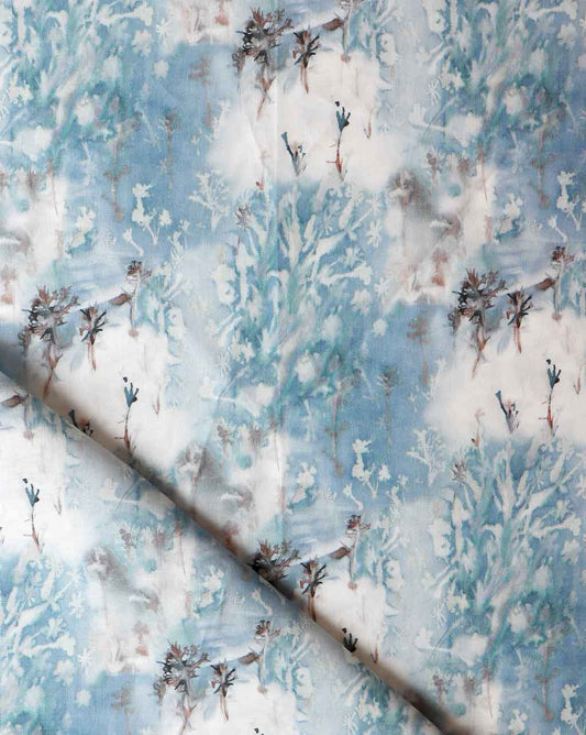 A blue and white Thalassa fabric with birds on it.