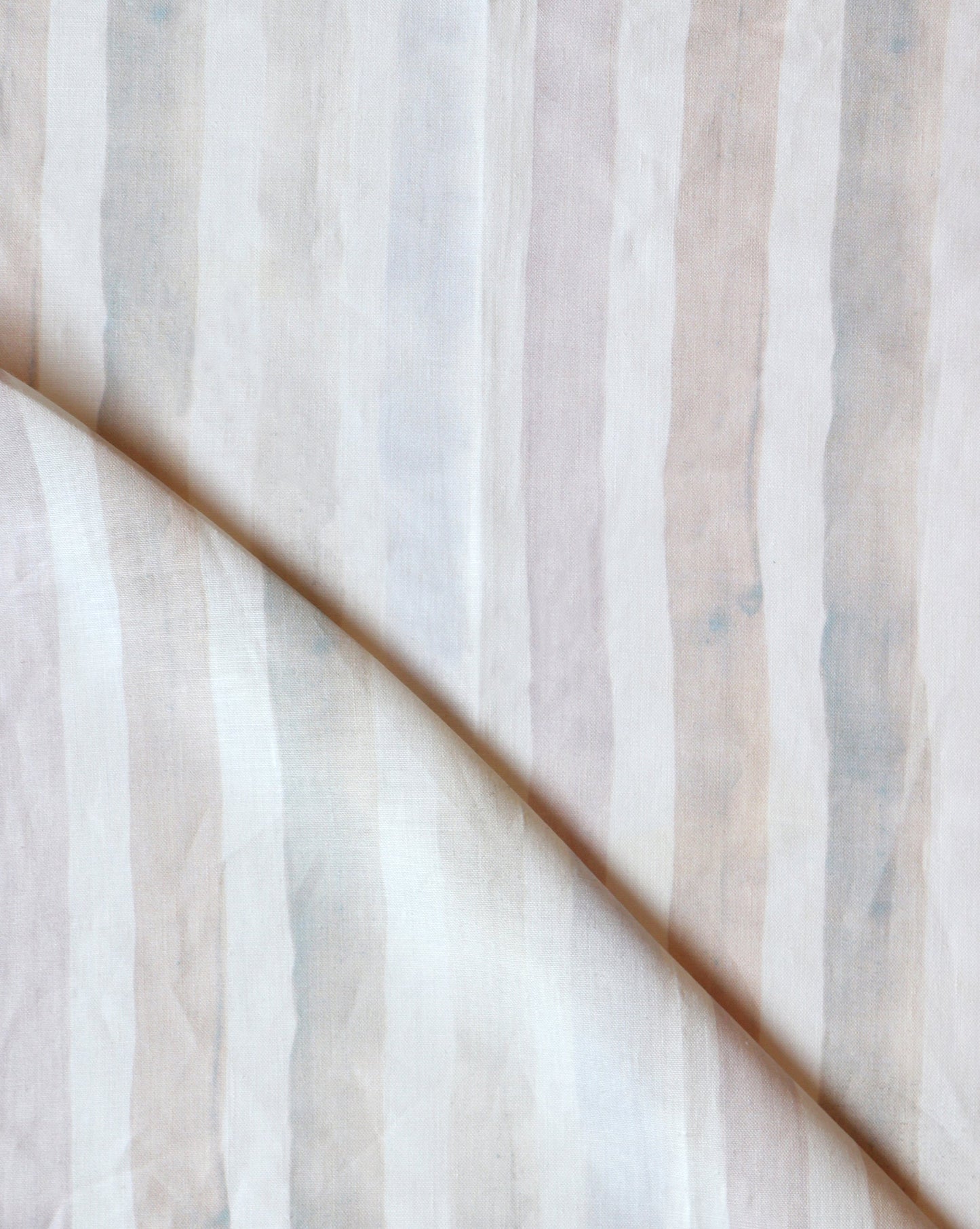 A close up of an enduring design featuring Gradient Stripe Fabric Pink Island, a spectrum of tones on beige fabric