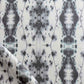 A close up of a black and white Hive Fabric in the Waterstone colorway