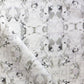 A white and gray Huerfano Fabric||Sol with a Presidio Collection floral pattern.