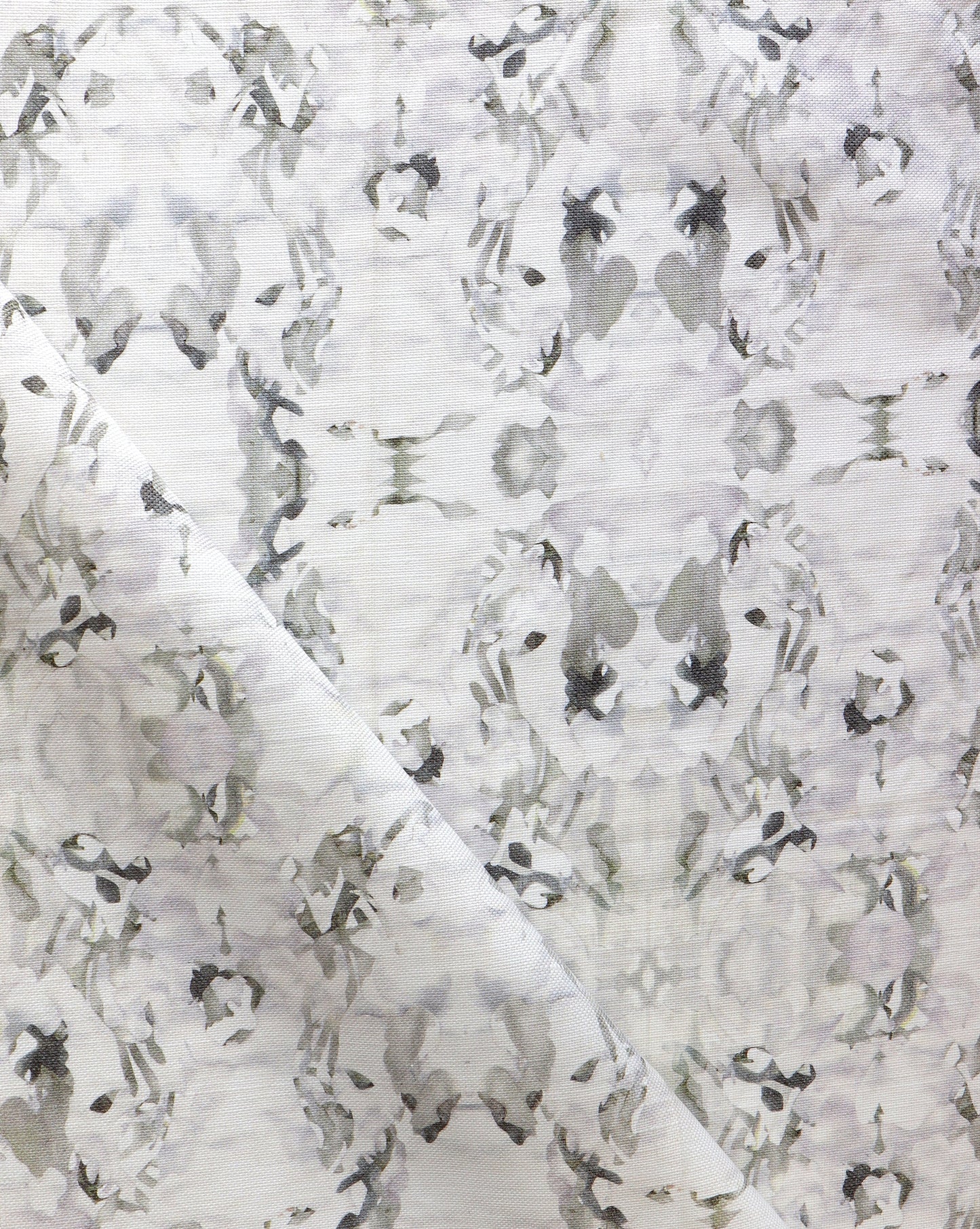 A white and gray Huerfano Fabric||Sol with a Presidio Collection floral pattern.