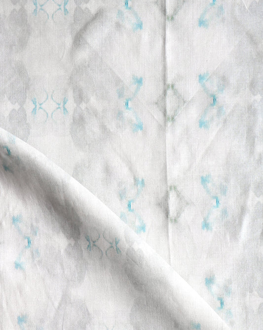 A close up of Icelandic Mist Fabric with blue and white designs