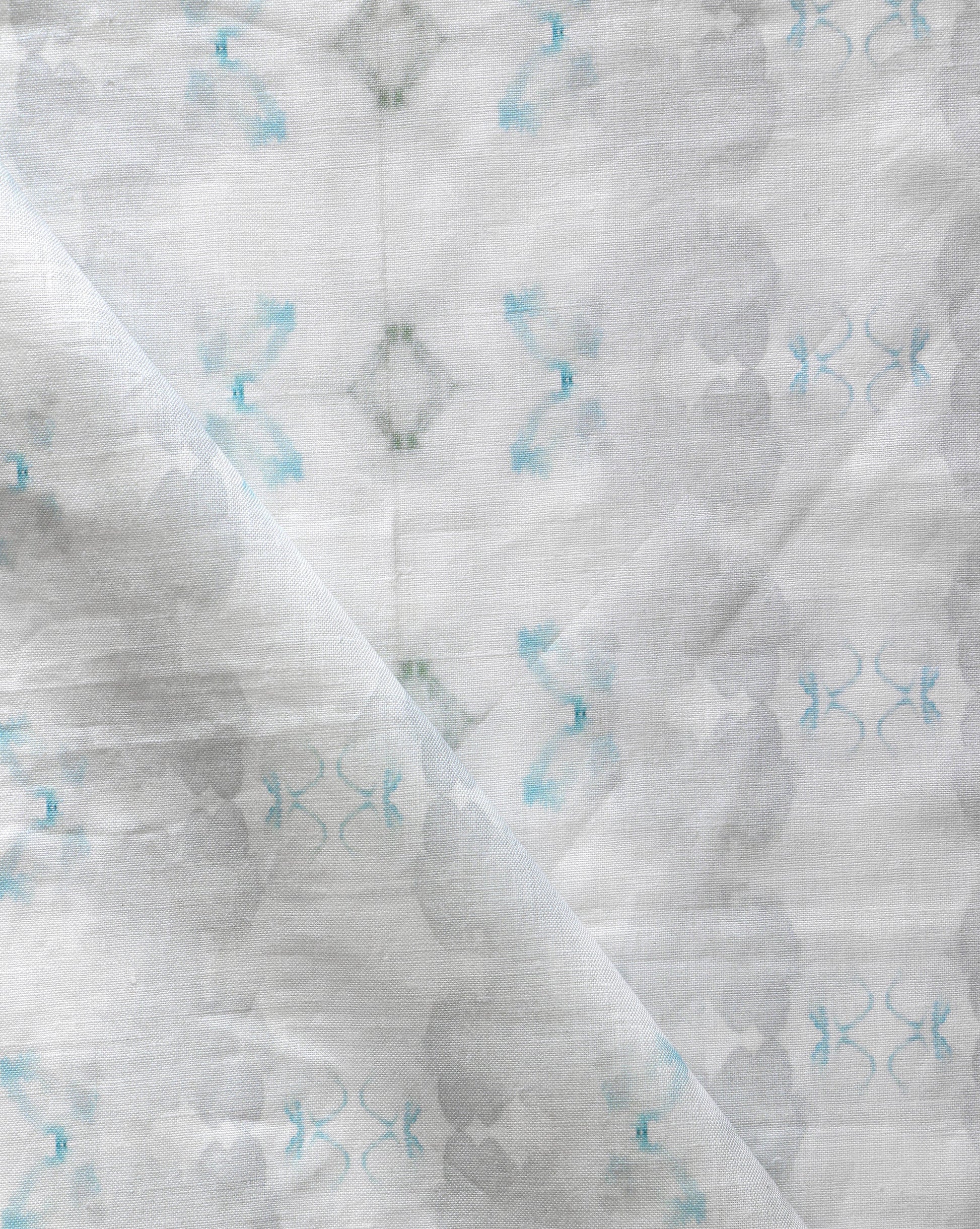 A close up of a Icelandic Mist Fabric Sky Blue swaddle blanket in Sky Blue