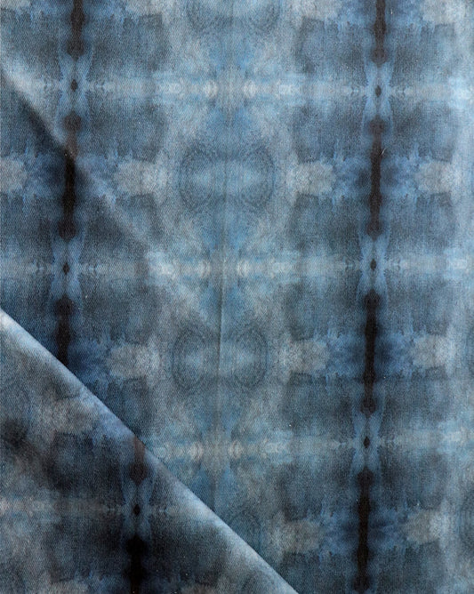 A close up of a Kusafiri Fabric Indigo tie dyed fabric