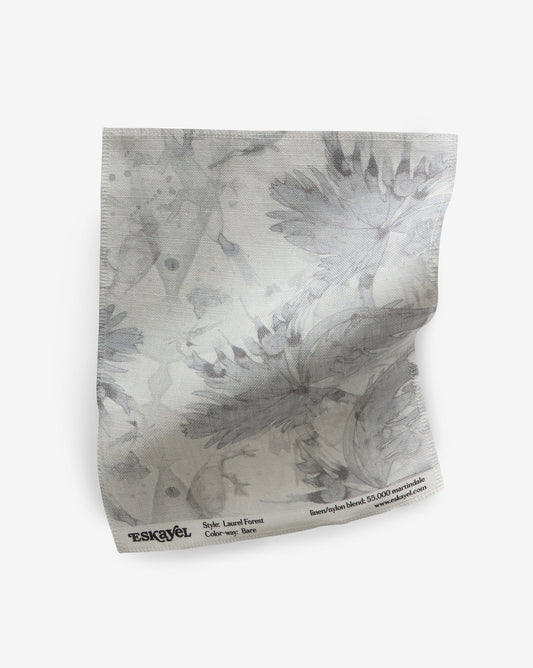 A white Laurel Forest Fabric Sample Bare with a floral pattern on it