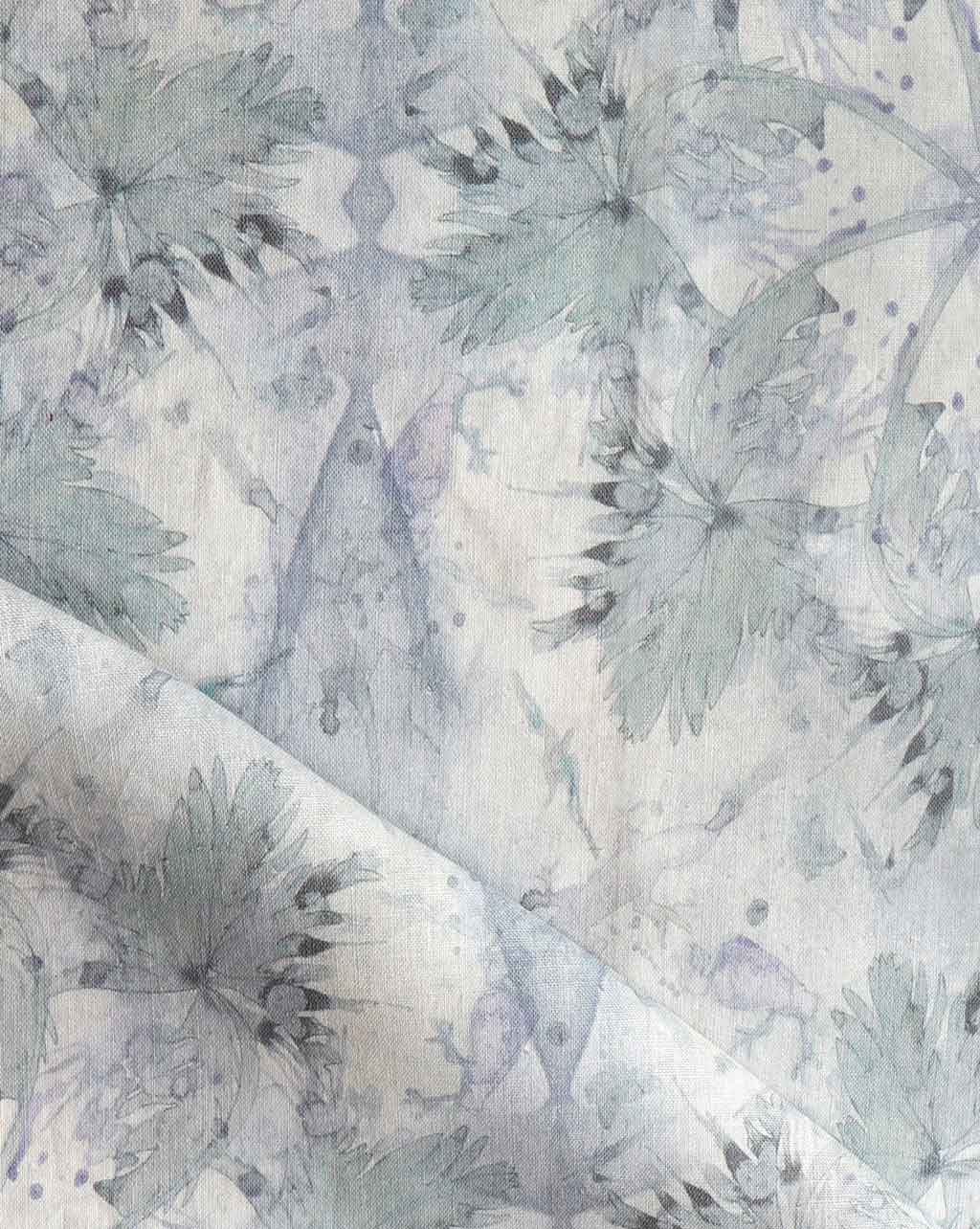 A close up of a blue and white Laurel Forest Fabric Dove with a tropical atmosphere
