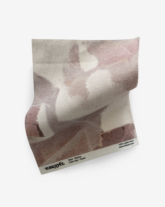 A Medina Fabric Sample Pausa with a pink and white pattern on it