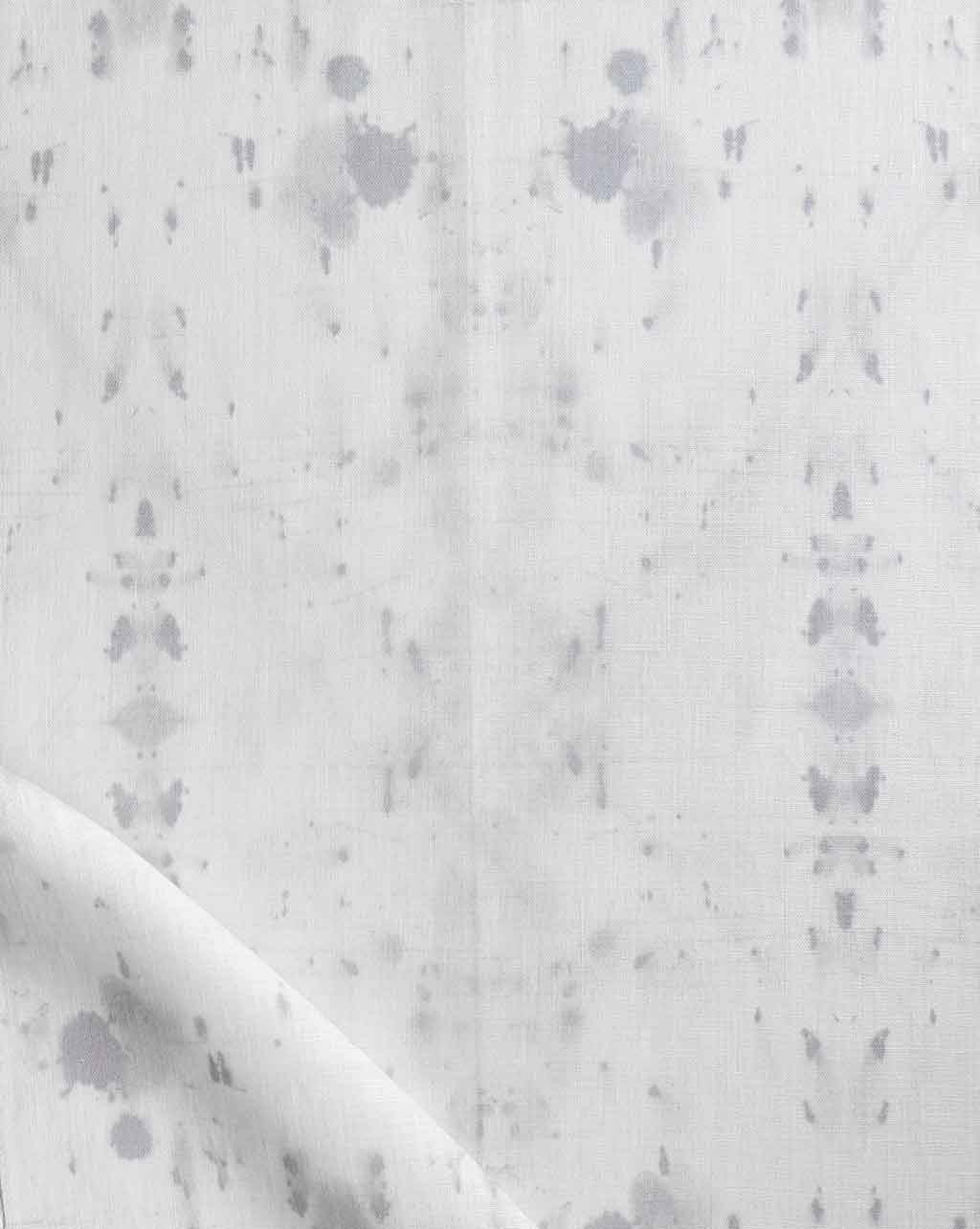 An image of a white and gray fabric with splotches on it from the Nairutya Fabric Chalk colorway