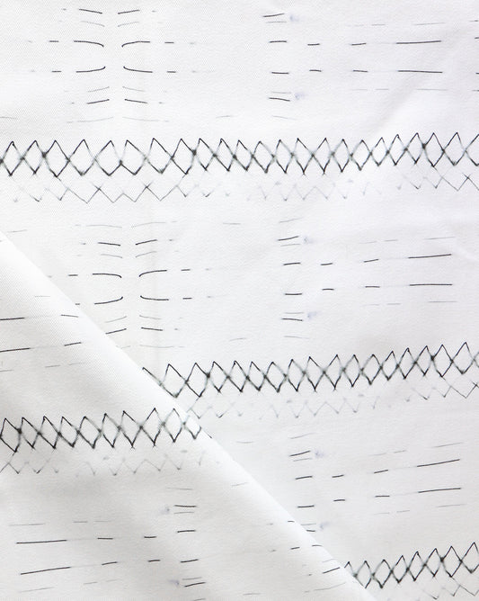 A close up of Native Stripe Fabric Black + White, perfect for custom fabric or interior schemes