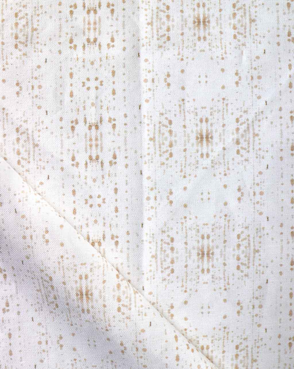 A white and gold Omaha Kinship Fabric Flax with dots on it, featuring the Eskayel high-end Omaha Kinship pattern in the Flax colorway