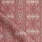 A pink and white Omaha Kinship fabric with a geometric pattern, inspired by the Kwoma people of Papua New Guinea
