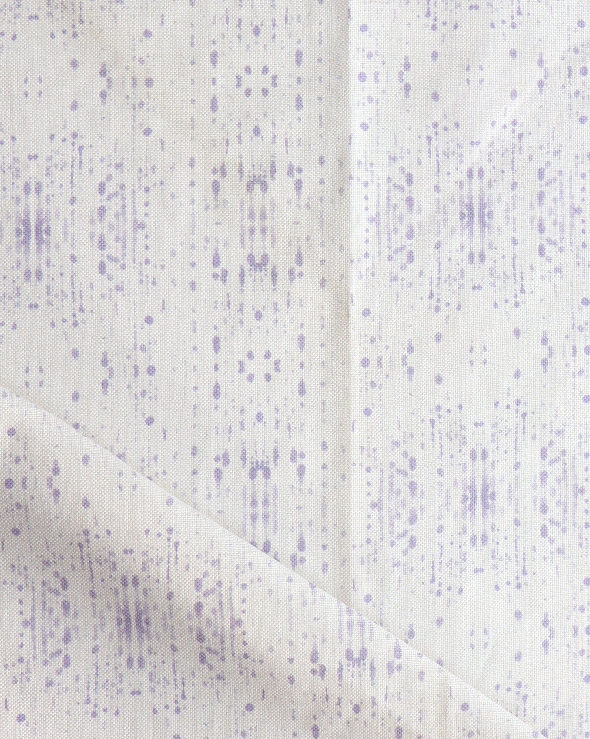 A white and purple Omaha Kinship Fabric Mulberry with dots on it, inspired by oceanic art