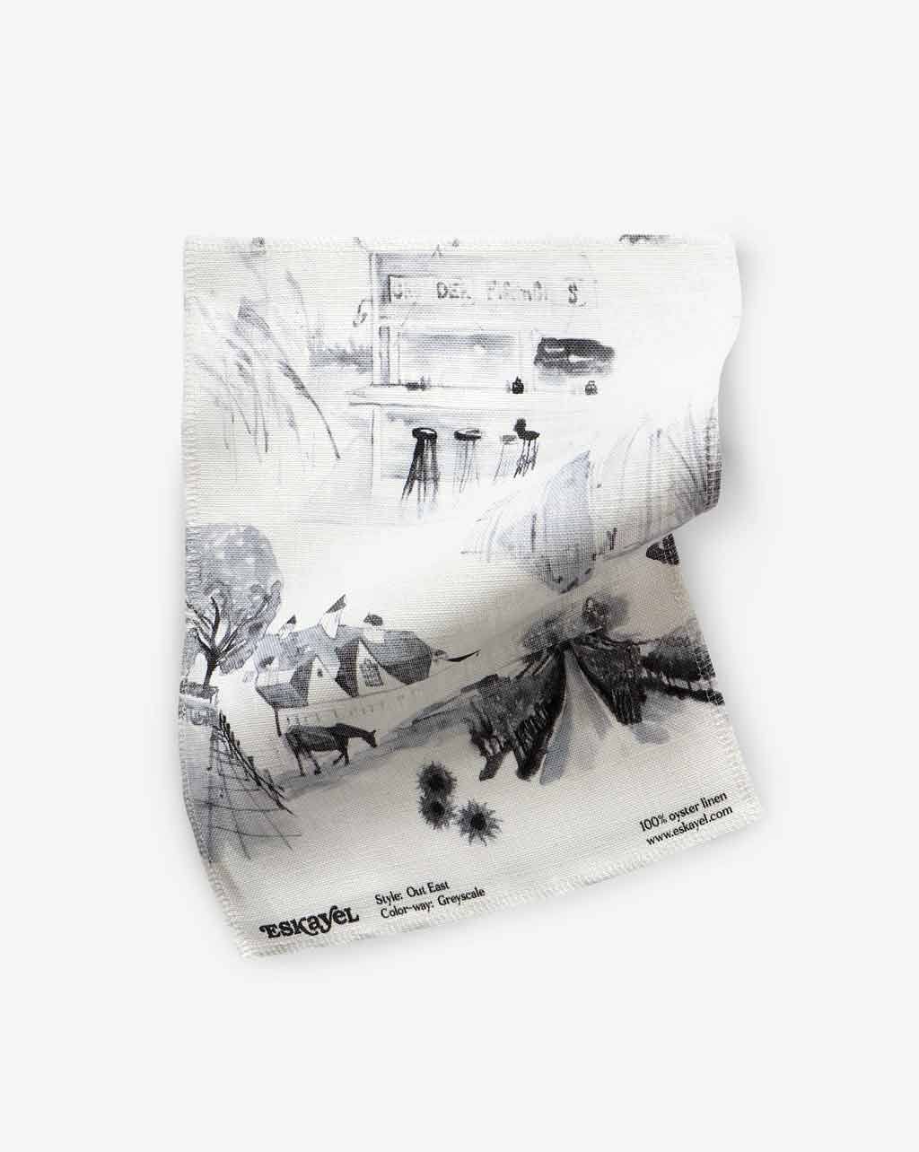 A modern Out East Fabric Greyscale pattern on a piece of fabric with drawings