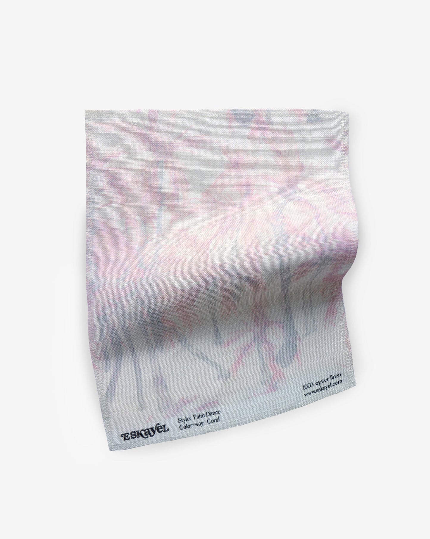 A pink and white Palm Dance Fabric Coral fabric with a palm tree watercolor pattern