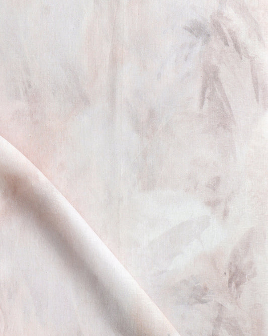 A close up of Palmeti Fabric with peachy pink tones