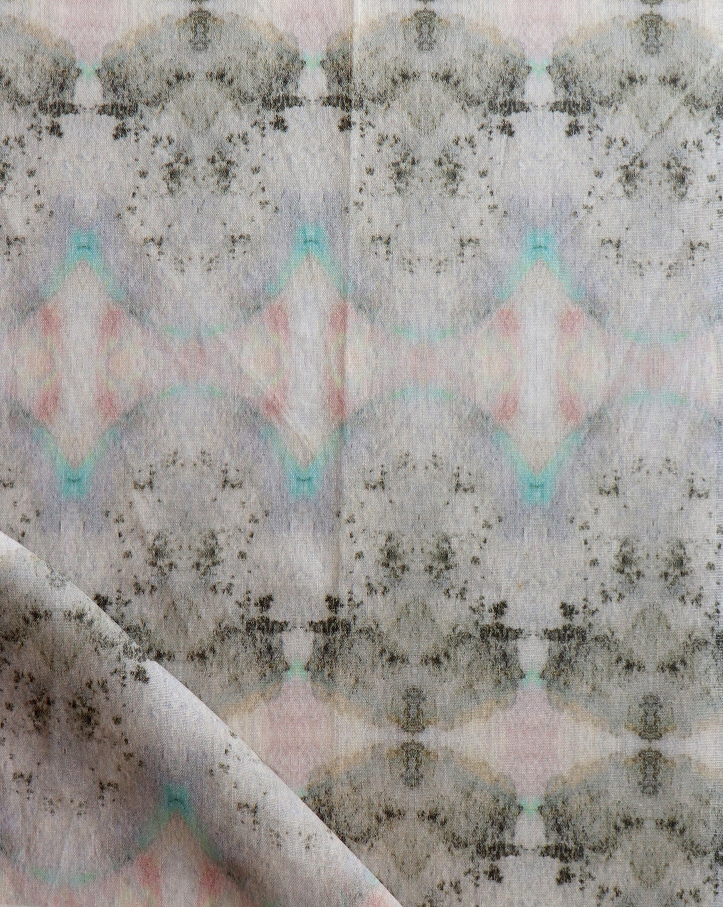 A piece of Parvati fabric from Eskayel’s Dea Collection, featuring watercolor pigments in pink, green, and blue