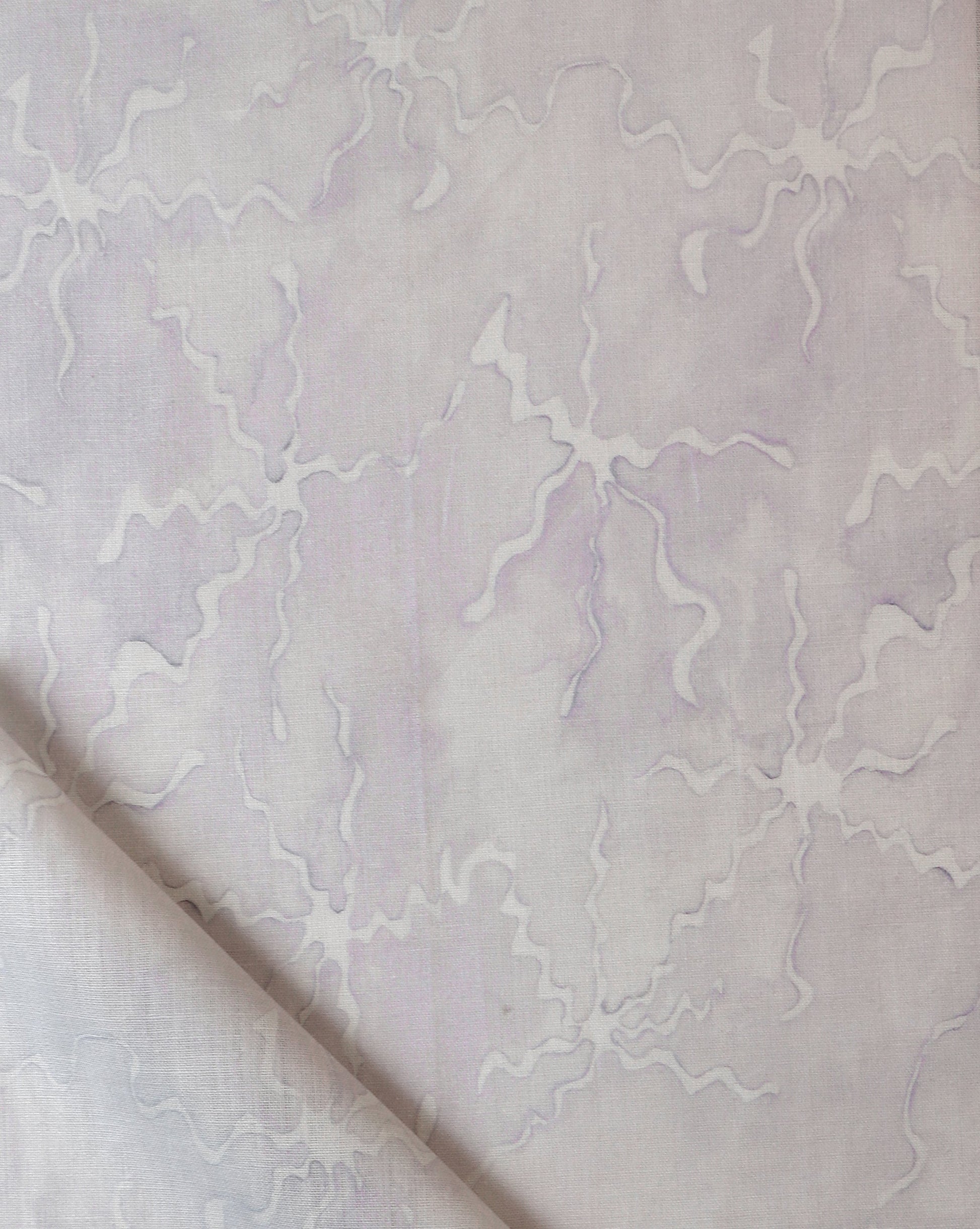 A white and purple Pecosa Fabric Air with a fabric design on it