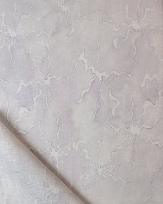 A white and purple Pecosa Fabric||Air with a fabric design on it.