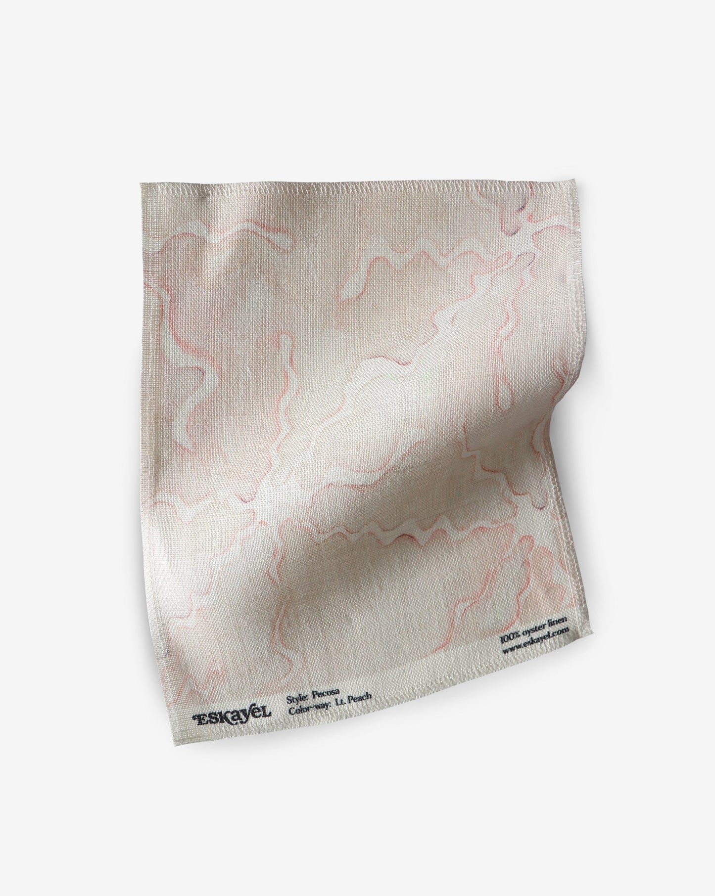 A Pecosa Fabric Sample||Light Peach handkerchief on a white order surface.