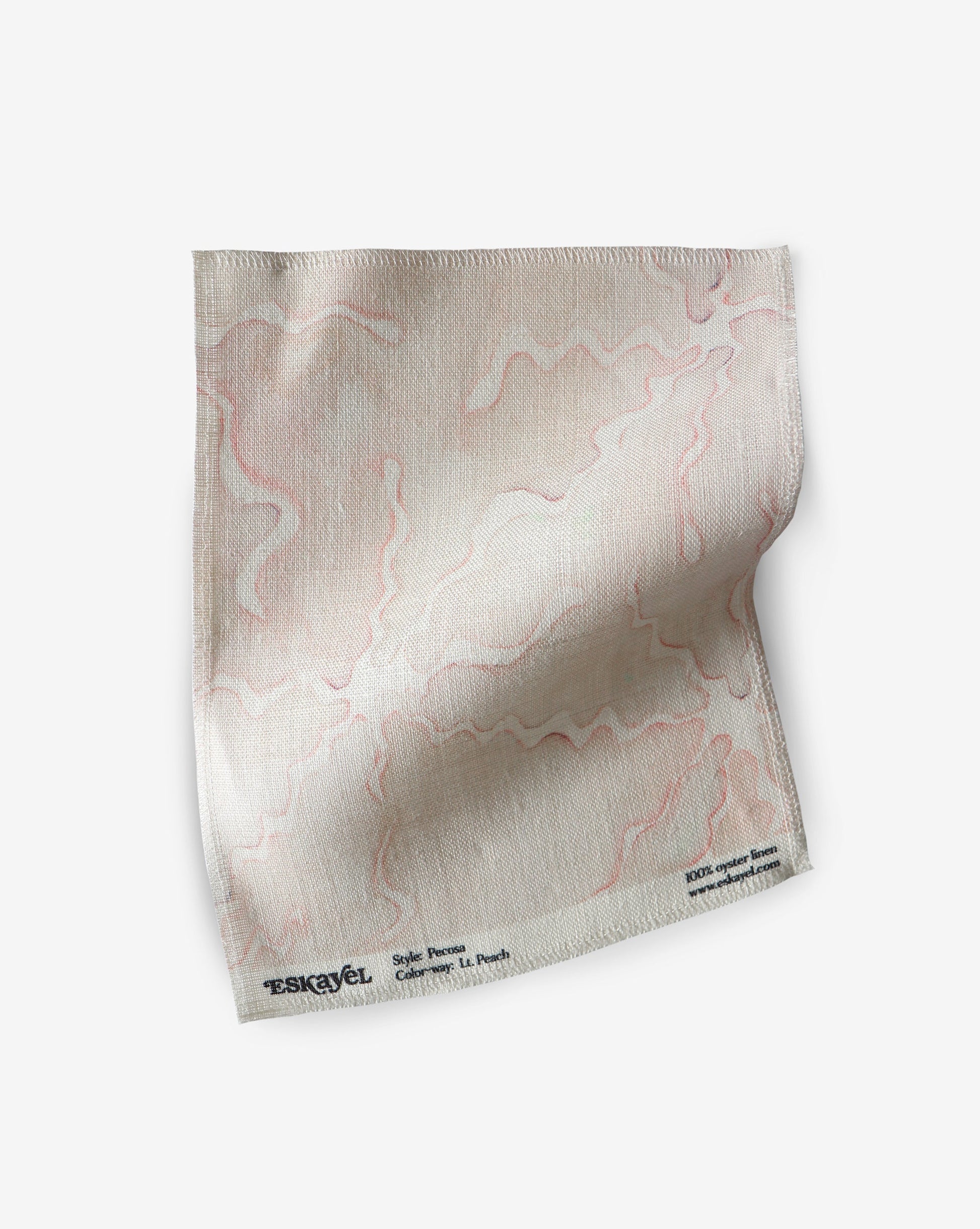A Pecosa Fabric||Light Peach handkerchief made of fabric on a white surface.