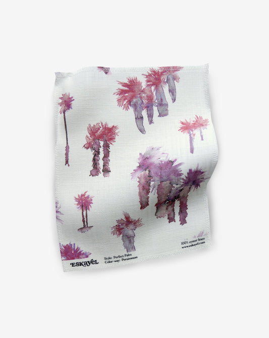 A pink and purple Perfect Palm Fabric Sample Persimmon fabric with palm trees on it