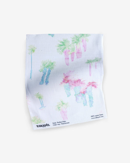 a sample of the Perfect Palm Fabric Sample Polychrome fabric with palm trees on it