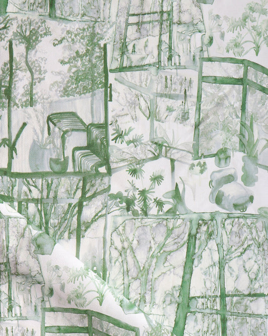 A green and white Quotidiana Fabric||Chloros with images of a garden fabric.