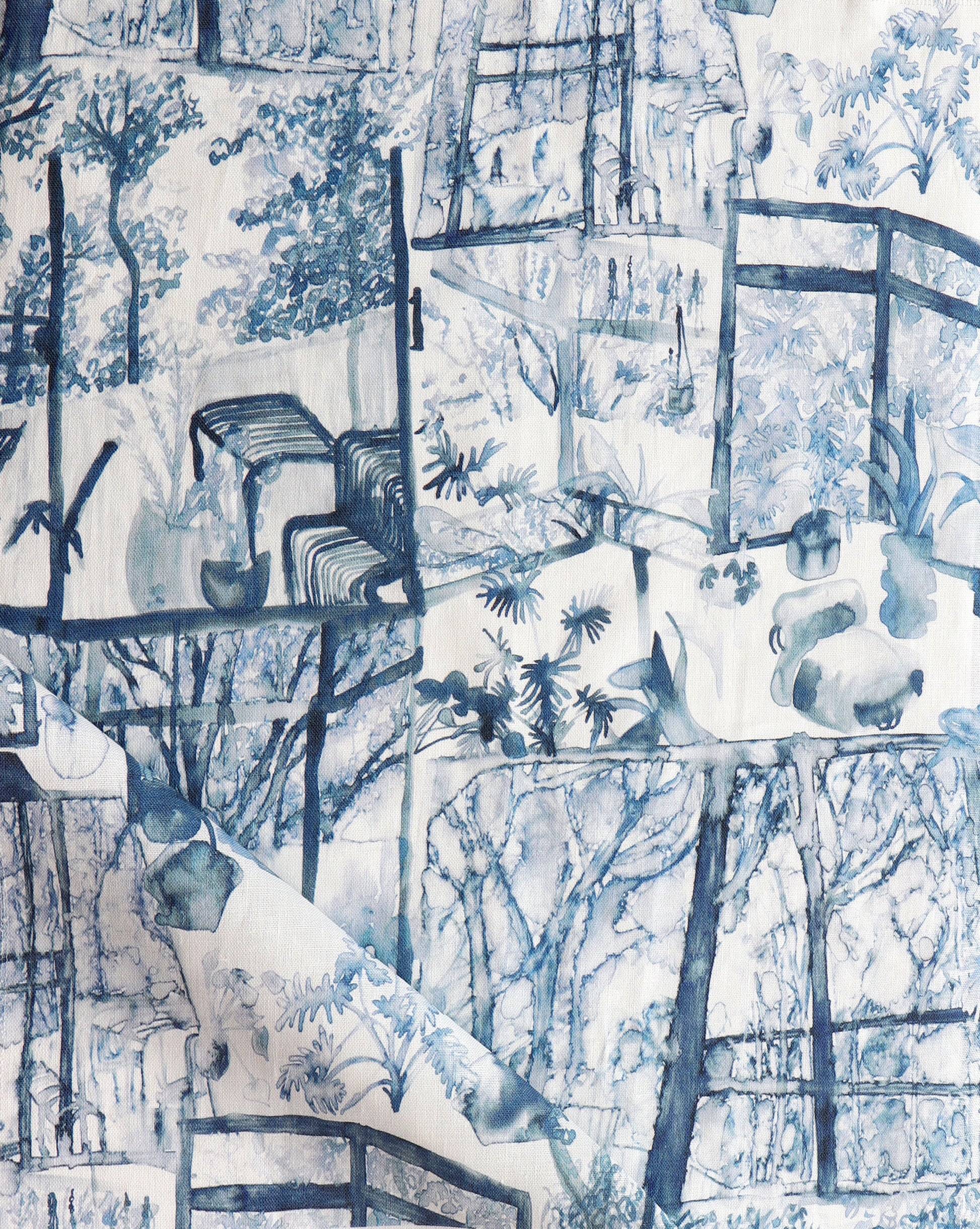 A blue and white Quotidiana Fabric Midnight with images of birds and trees