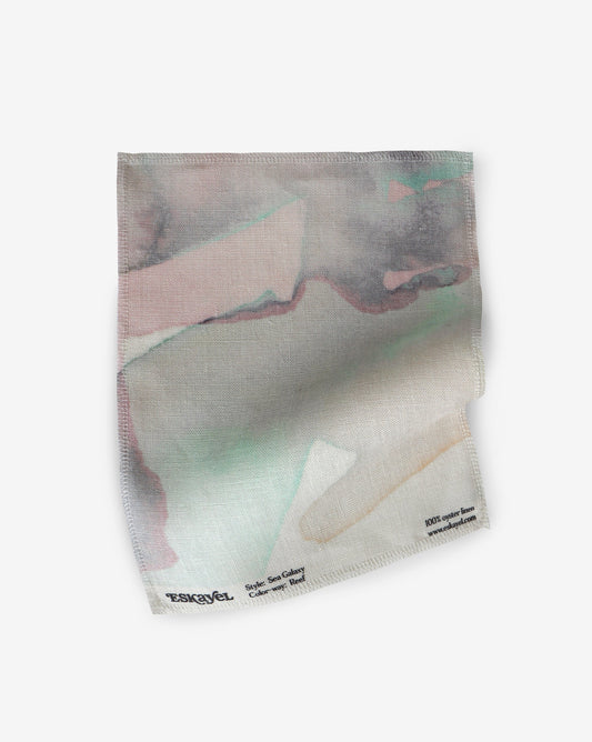 Sea Galaxy Reef Fabric sample is watercolor artwork featuring both intricate and graphic with defined organic shapes in a fluid watercolor style in shades of grey, mint green and peach with hints of black | Eskayel