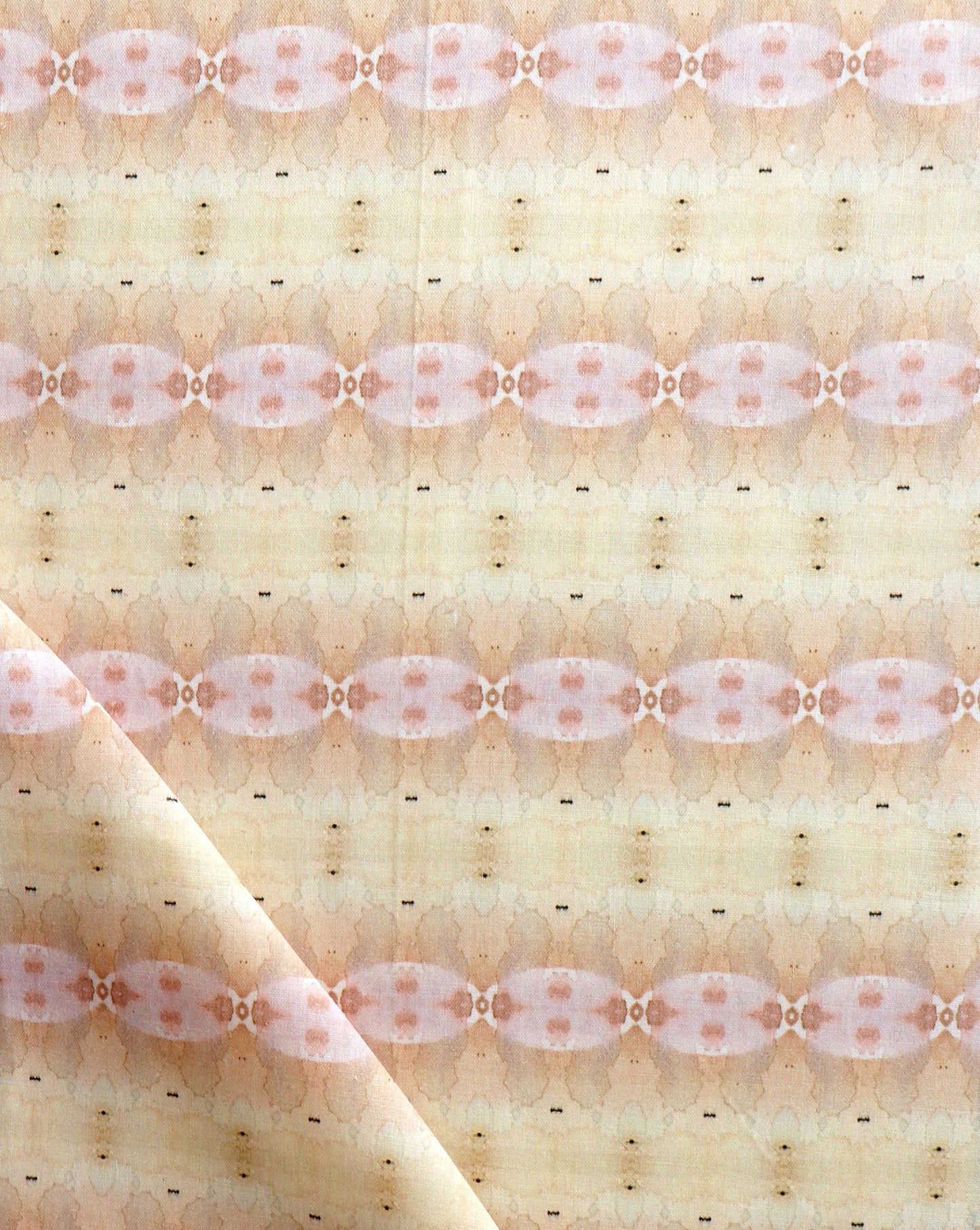 A close up of Setting Sun Fabric with a light terracotta and beige pattern.