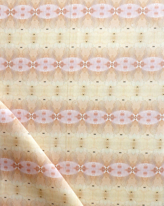 A close up of Setting Sun Fabric with a light terracotta and beige pattern