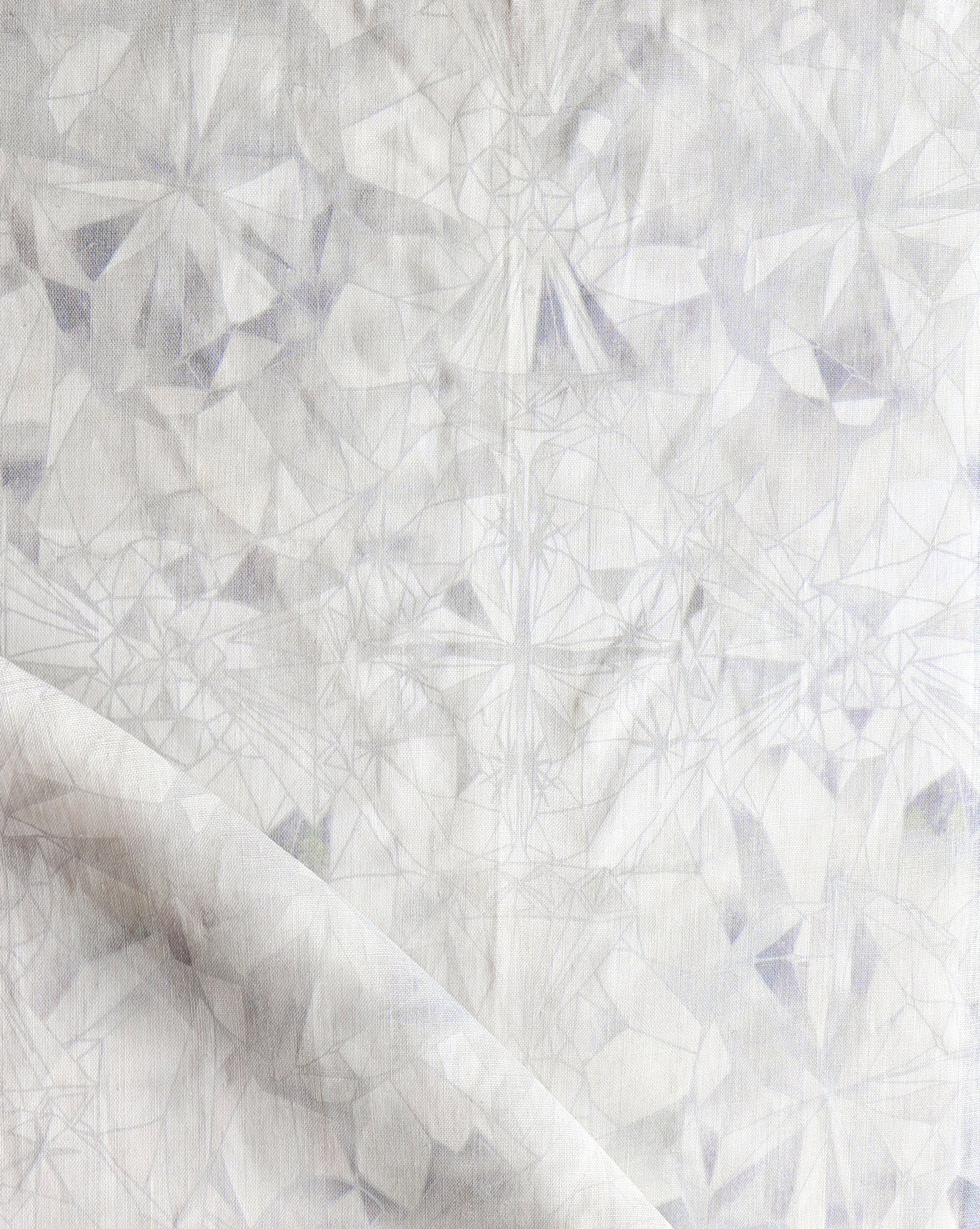 A close up of a white Solitaire Fabric Pearl with a Solitaire pattern on it