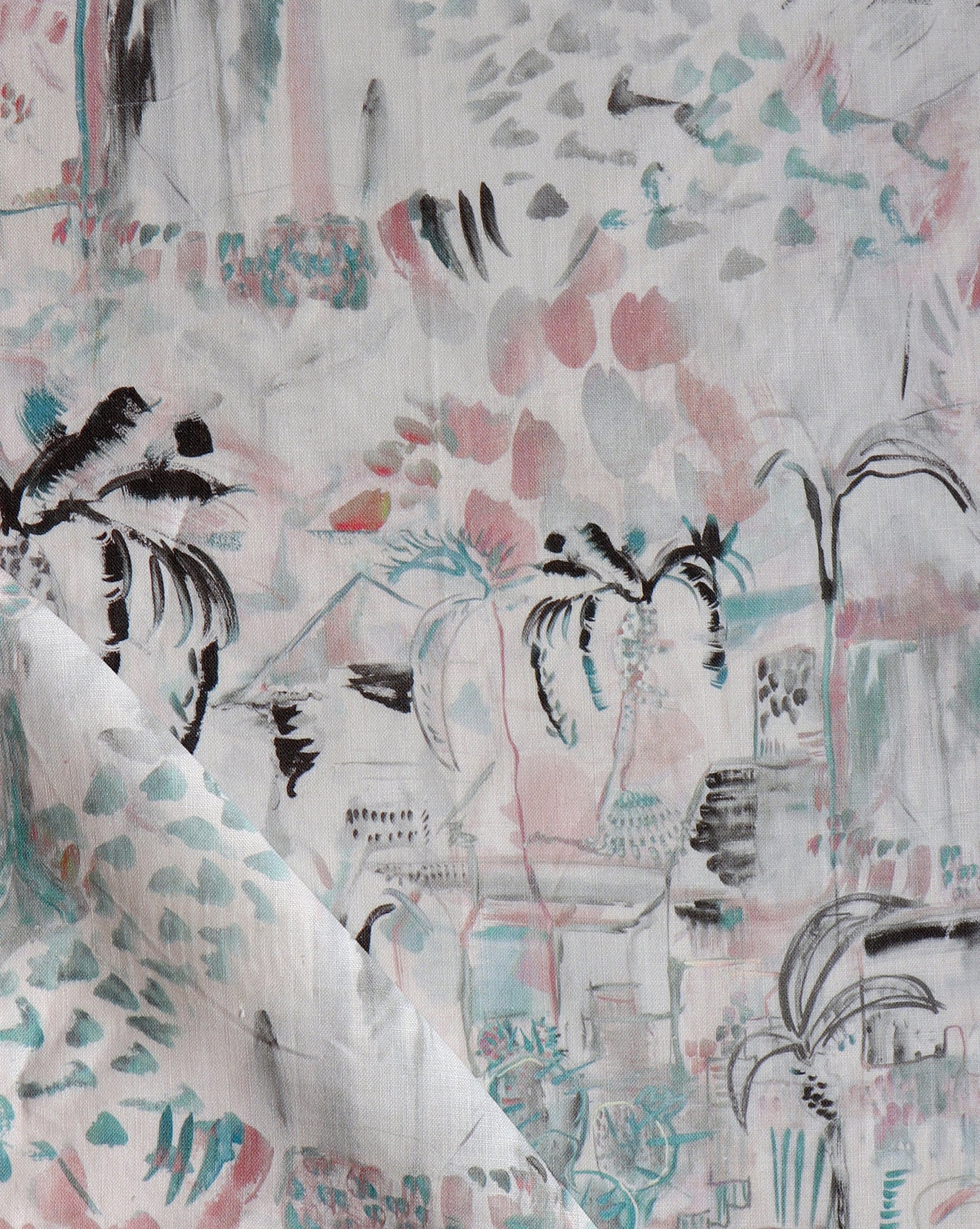 A close-up of a pink and blue Souk Fabric with palm trees on it at Marrakech's Souk