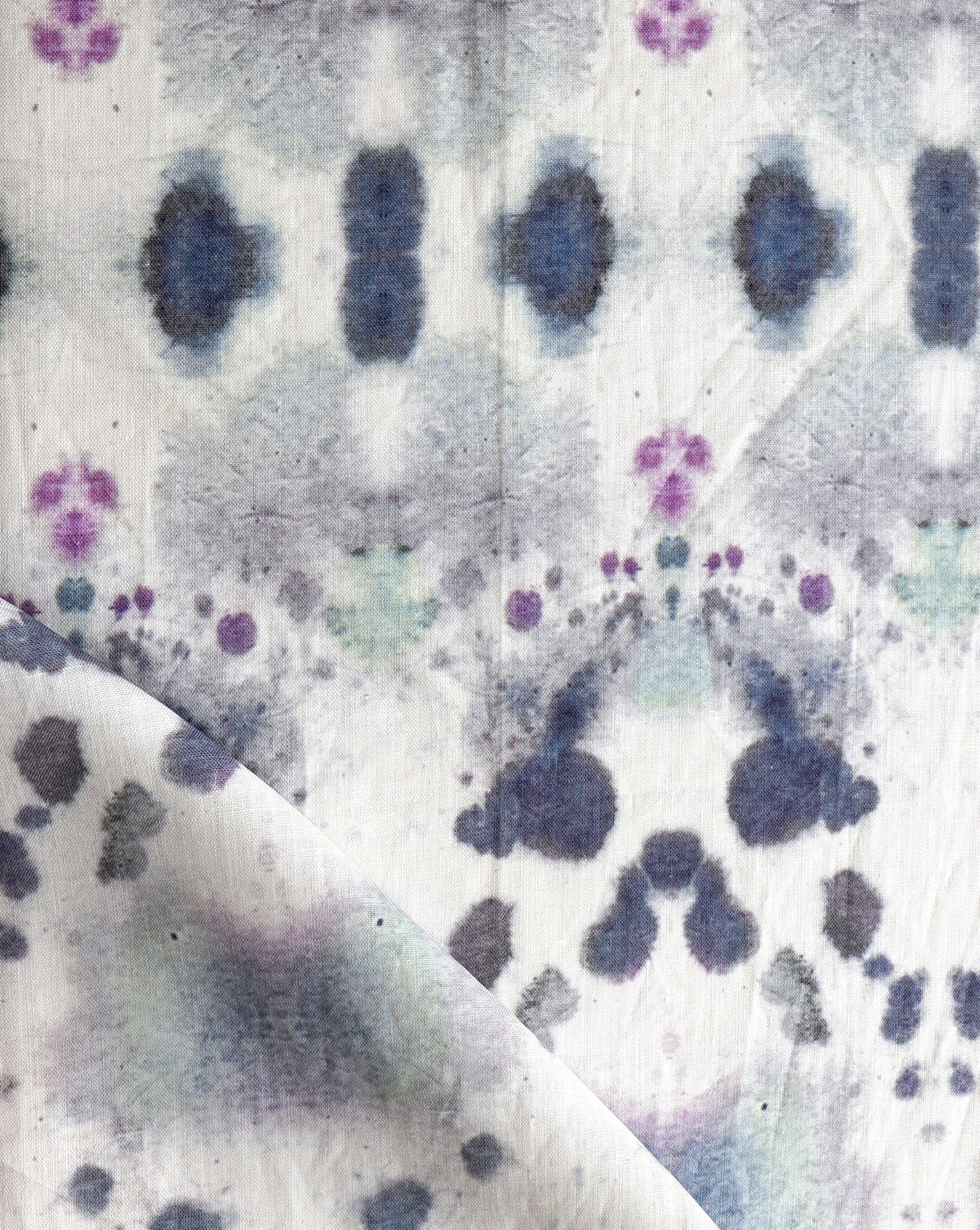 A close up of a blue and purple Species Fabric with a kaleidoscopic effect.