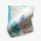 A piece of Splash Fabric Pool with watercolor splatters on it