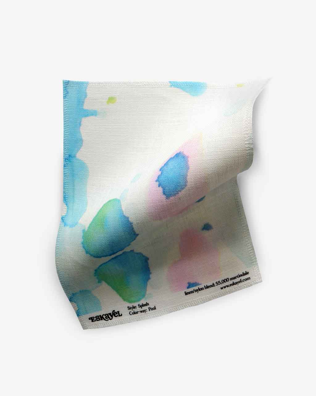 A piece of Splash Fabric Pool with watercolor splatters on it