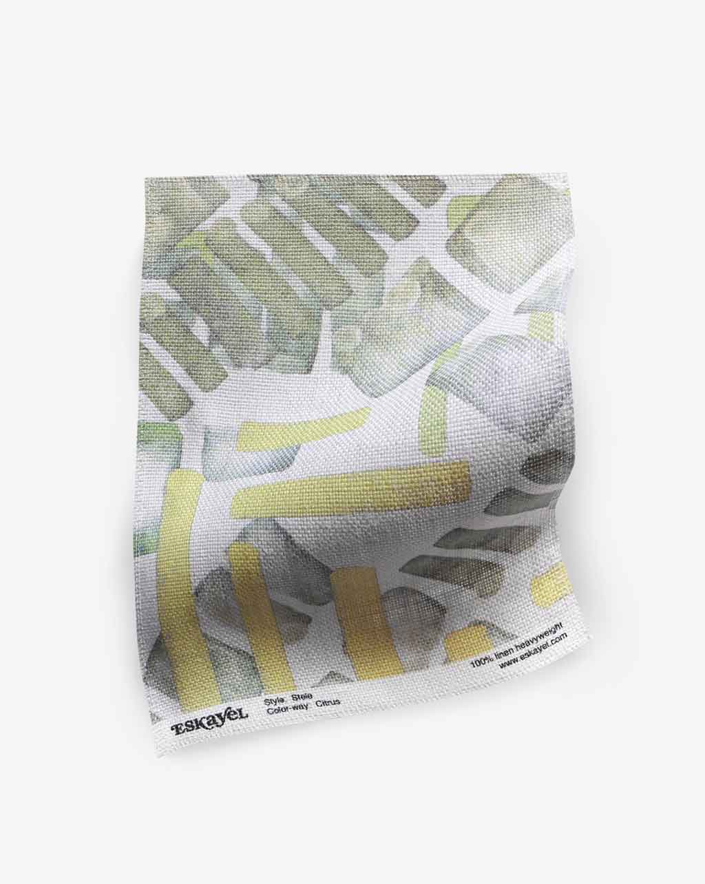 A luxury high-end Stele Fabric Citrus fabric with a yellow and white graphic pattern on it