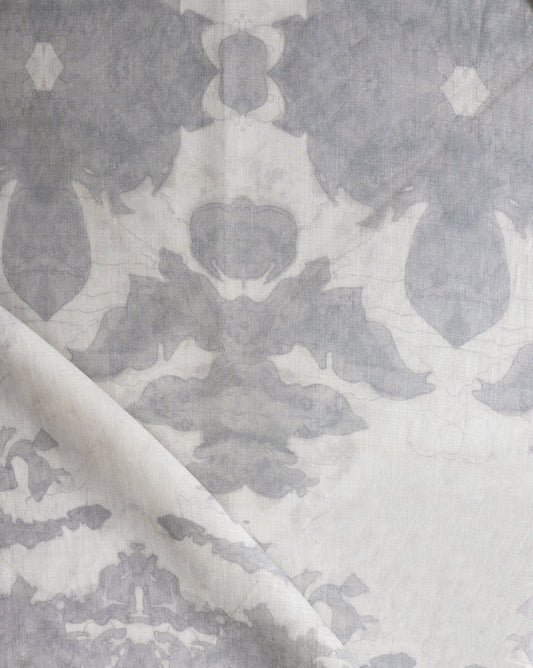 A close up of a luxury fabric from The Dance Fabric Cloud Collection, in a grey and white colorway