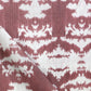 A close up of a red and white The Dance Fabric from the Lora Collection