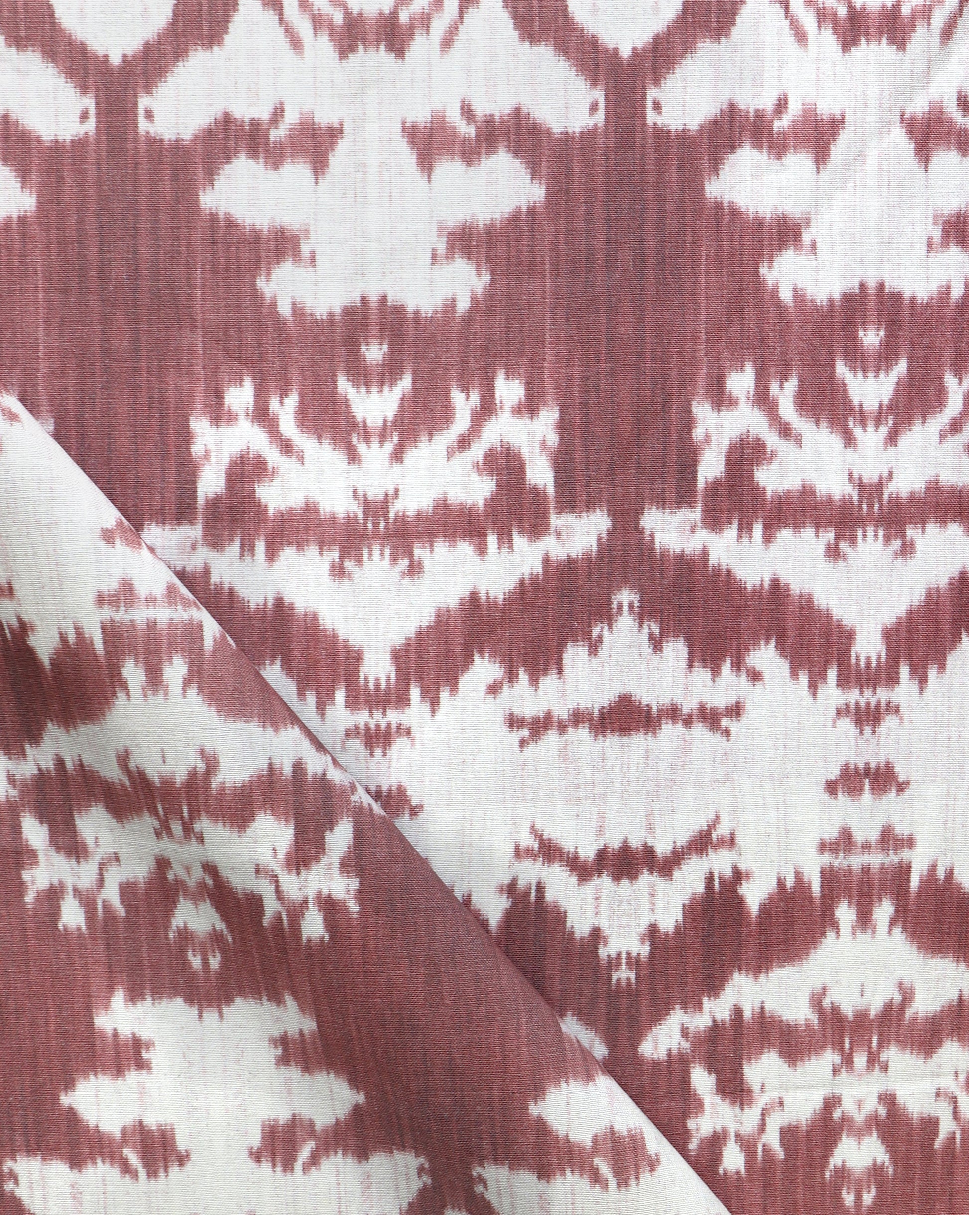 A close up of a red and white The Dance Fabric from the Lora Collection
