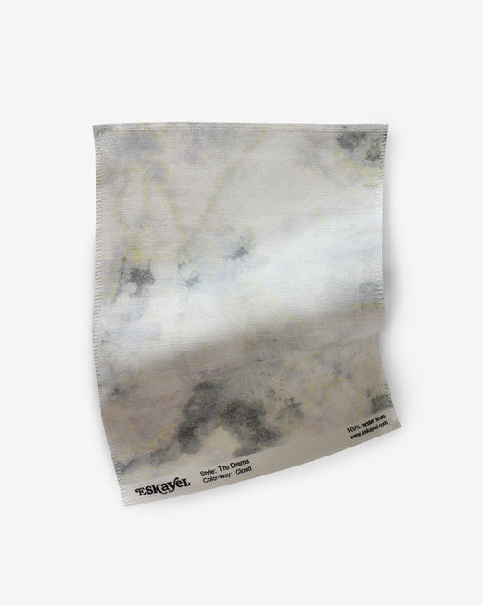 A sample of The Drama Fabric Sample Cloud with a marble pattern on it