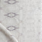 A white and gray luxury fabric with a pattern from The Knitting Fabric Rooster Collection