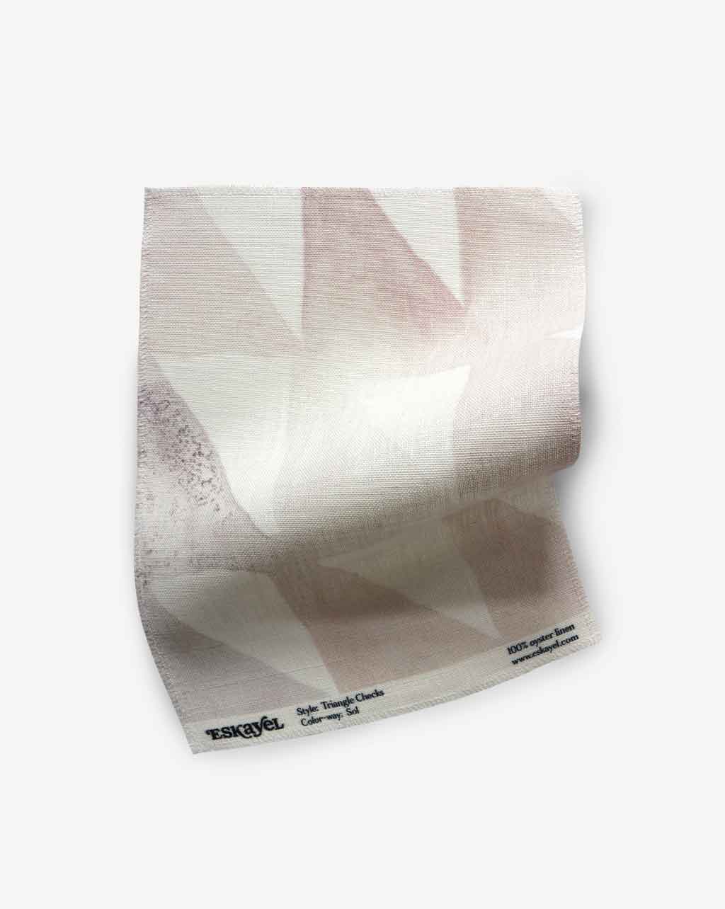 A Triangle Checks Fabric Sample with a pink and white pattern on it