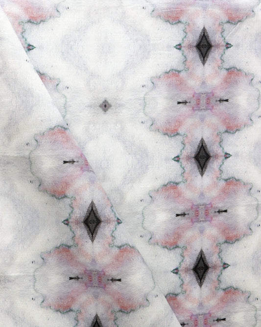 A close up of a white Twinkle Fabric Pink from the Galaxy Collection with a pink and black design