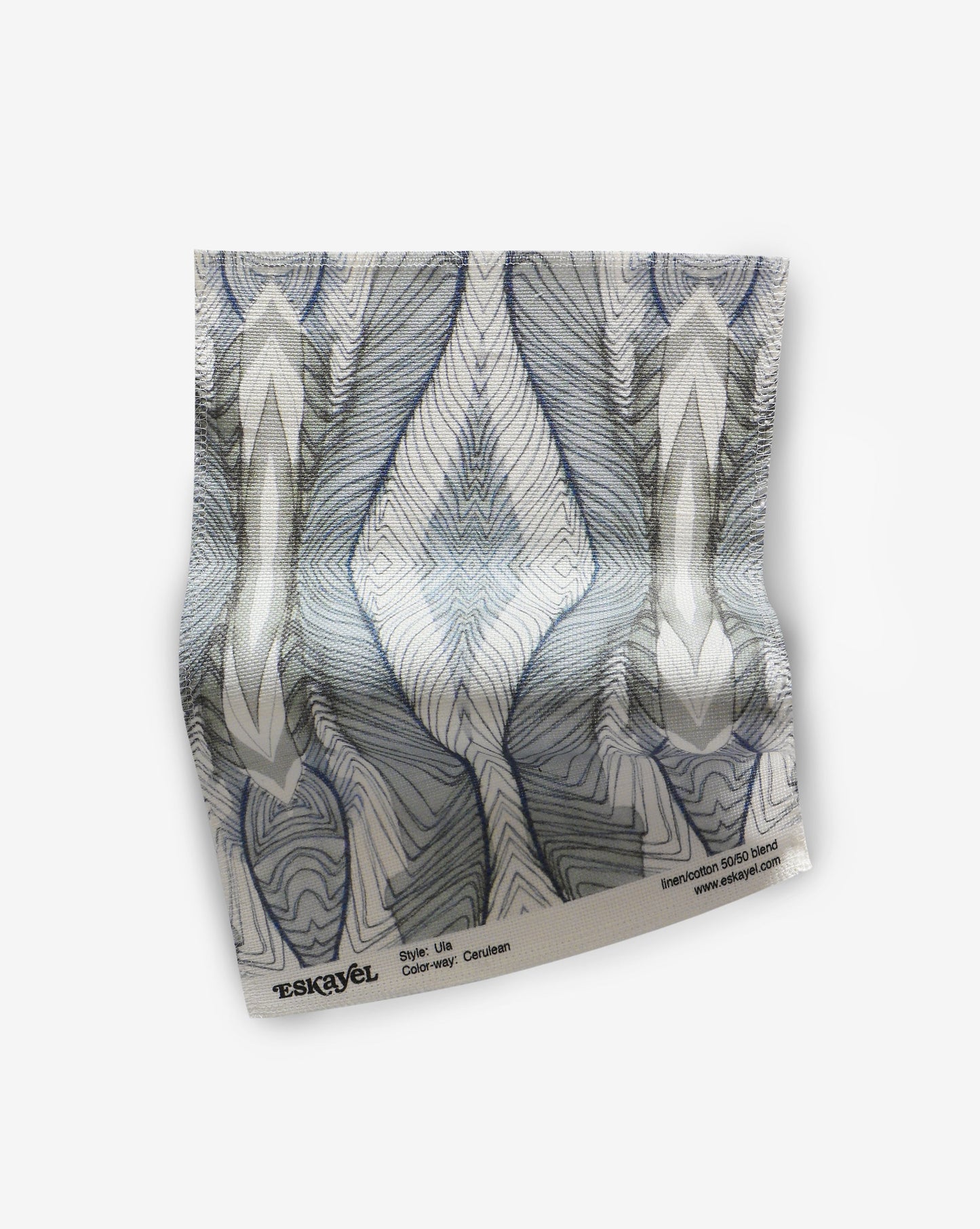 A piece of Ula Fabric Cerulean with a blue and white pattern on it made from high-end fabric