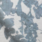 A close up of a blue and white print on an Up For Anything Fabric Cerulean, abstract botanical pattern