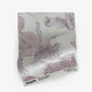 A luxurious Up For Anything Fabric||Glimmer with an abstract botanical pattern in pink and white, featuring a flower.